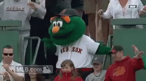 A Mascot For The Red Sox Is Dancing In The Stands . GIF