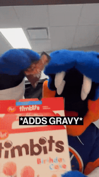 A Mascot Is Holding A Box Of Timbits Birthday Cake GIF
