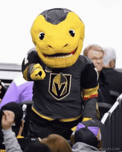 A Mascot Is Pointing At The Camera While Standing In Front Of A Crowd . GIF