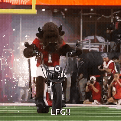 A Mascot Is Riding A Motorcycle On A Field And Says Lfg GIF