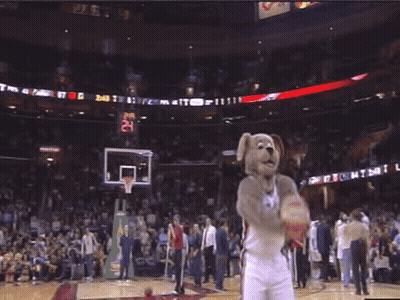 A Mascot On A Basketball Court Wearing A Jersey With The Letter C On The Back GIF