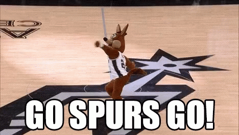 A Mascot On A Basketball Court With The Words Go Spurs Go On The Bottom . GIF