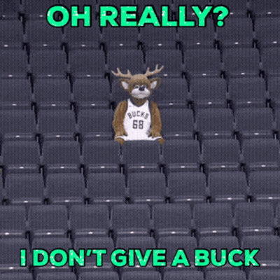 A Mascot Wearing A Bucks Jersey Is Sitting In The Stands GIF