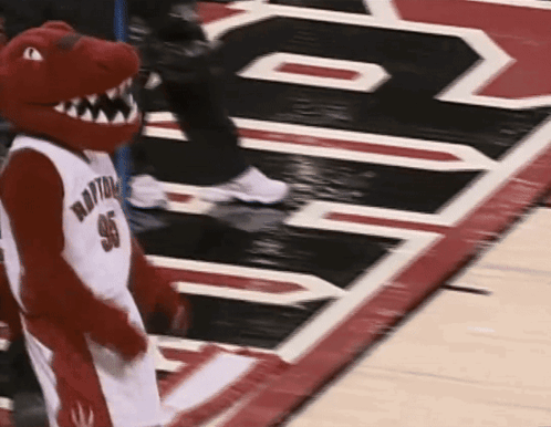 A Mascot Wearing A Jersey That Says Raptors 96 GIF