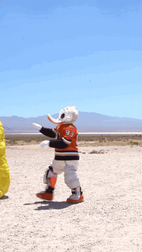 A Mascot Wearing A Jersey With The Number 99 GIF