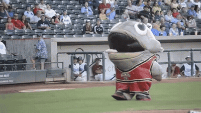 A Mascot Wearing A Red And Black Jersey With The Number 18 On It GIF