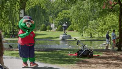 A Mascot Wearing A Red White And Blue Shirt That Says Boston Red Sox GIF