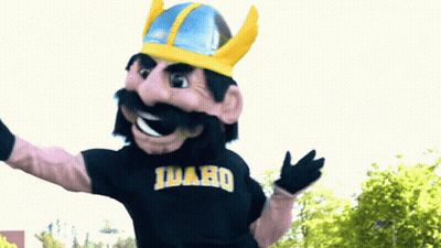 A Mascot Wearing An Idaho Shirt And A Helmet GIF