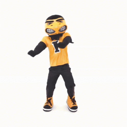 A Mascot With The Letter I On His Shirt Is Dancing GIF