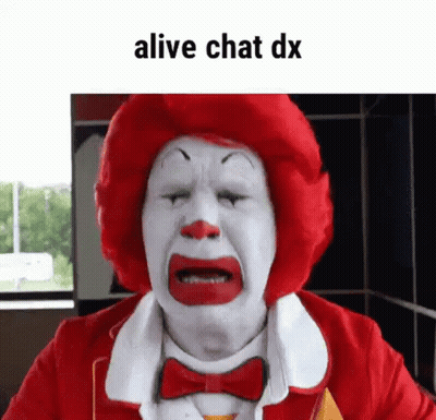A Mcdonald 'S Clown Is Crying With His Eyes Closed And A Red Wig . GIF
