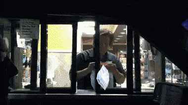 A Mcdonald 'S Drive Thru Window Has A Sign On It That Says ' No Smoking ' On It GIF