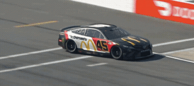 A Mcdonald 'S Race Car Is On The Track GIF