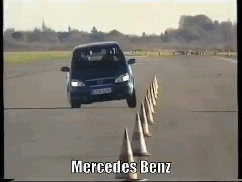 A Mercedes Benz Car Is Driving Through A Maze Of Cones GIF