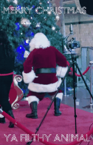 A Merry Christmas Greeting Card With Santa Dancing On The Red Carpet GIF