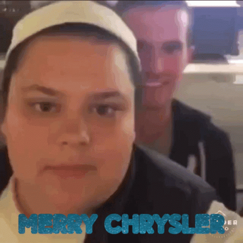 A Merry Chrysler Advertisement With A Man And Woman GIF