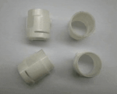 A Metal Mould With A Lot Of Holes In It Is Sitting On A White Surface . GIF