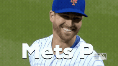 A Mets Baseball Player Is Smiling And Wearing A Blue Cap GIF