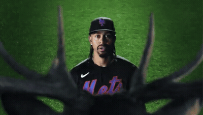 A Mets Baseball Player Stands In Front Of A Deer GIF