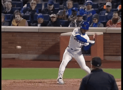 A Mets Baseball Player Swings His Bat At A Ball GIF