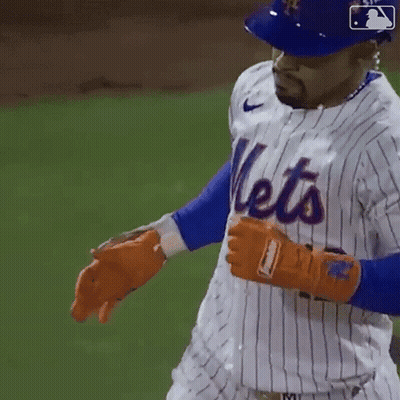 A Mets Player Wearing A Blue Helmet And A White Striped Jersey GIF