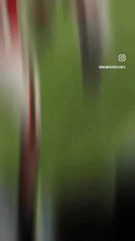 A Miami Hurricanes Advertisement With A Blurry Background GIF