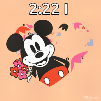 A Mickey Mouse Holding A Bouquet Of Flowers Says Love You GIF