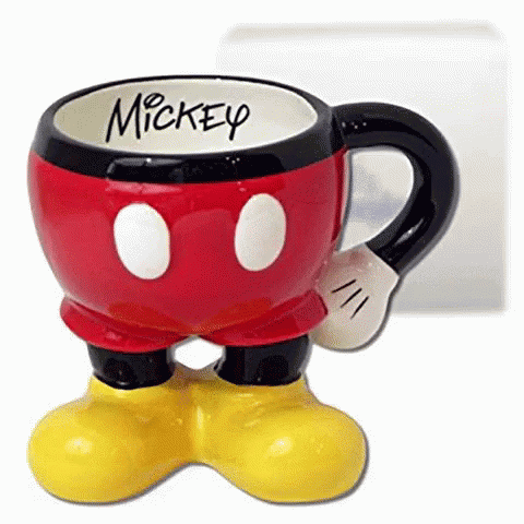 A Mickey Mouse Mug With Mickey Written On The Inside Of It GIF
