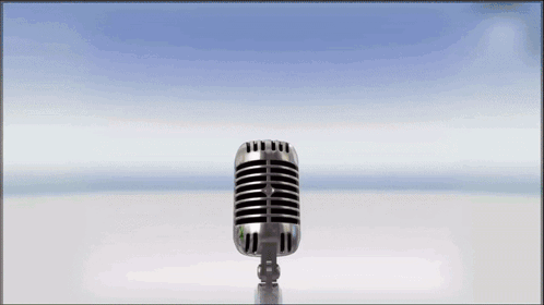 A Microphone With A Green Gummy Bear Behind It GIF