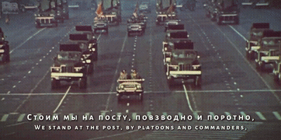 A Military Parade In A Foreign Language With The Words We Stand At The Post In The Lower Right Corner GIF