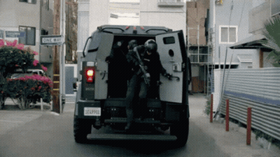 A Military Vehicle Has A License Plate That Says Eaa9910 GIF
