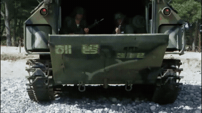 A Military Vehicle Has The Number 2 On The Back GIF