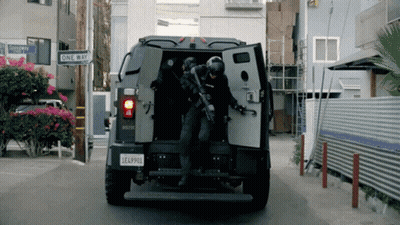 A Military Vehicle With A License Plate That Says Lea4900 GIF