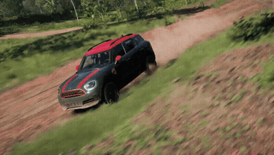 A Mini Cooper Is Driving Down A Dirt Road In A Video Game GIF