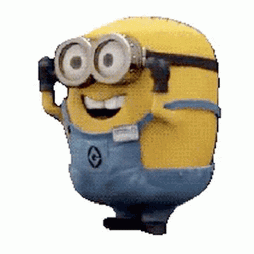 A Minion Wearing Goggles And Overalls Is Smiling . GIF