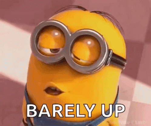 A Minion Wearing Goggles And The Words `` Barely Up '' On His Face . GIF