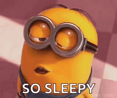 A Minion Wearing Goggles Is Saying `` So Sleepy '' With His Eyes Closed . GIF