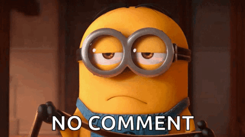 A Minion Wearing Goggles Says " No Comment " On A Brown Background GIF
