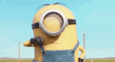 A Minion Wearing Overalls And Goggles Is Giving The Middle Finger . GIF
