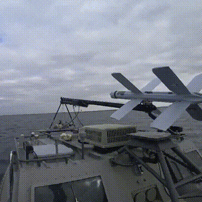 A Missile Is Being Launched From A Military Ship GIF