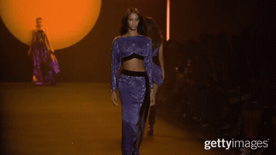 A Model Walks Down The Runway At A Fashion Show With The Caption Gettyimages GIF