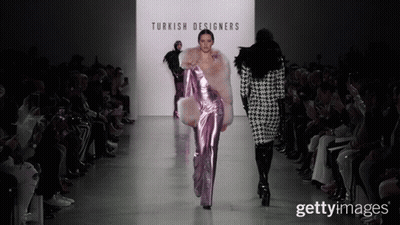 A Model Walks Down The Runway At A Turkish Designers Show GIF