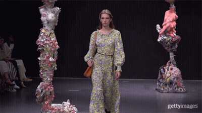 A Model Walks The Runway At A Fashion Show GIF