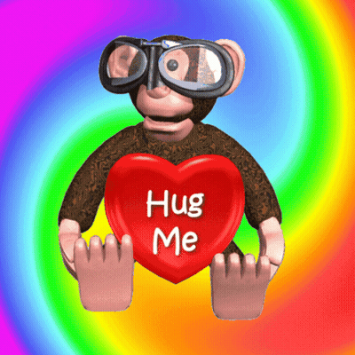 A Monkey Holding A Red Heart That Says Hug Me GIF