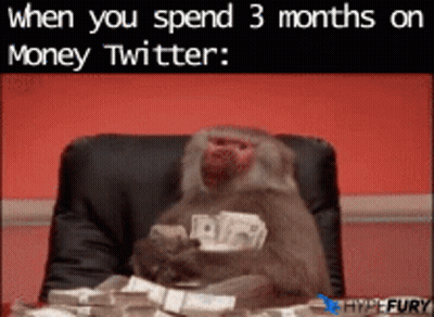 A Monkey Is Sitting In A Chair Holding A Pile Of Money With The Caption " When You Spend 3 Months On Money Twitter " GIF