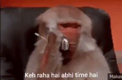 A Monkey Is Sitting In A Chair With A Gun In Its Mouth And Says Keh Raha Hai Abhi Time Hai . GIF