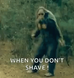 A Monkey Is Standing In The Dirt With The Words `` When You Don 'T Shave '' Written On It . GIF