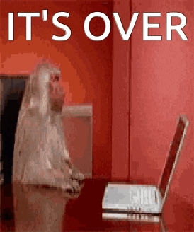 A Monkey Sitting In Front Of A Laptop With The Words It 'S Over GIF