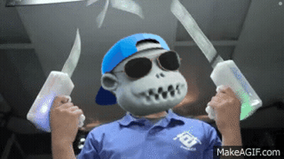 A Monkey Wearing Sunglasses And A Blue Hat Is Holding Two Knives .. GIF