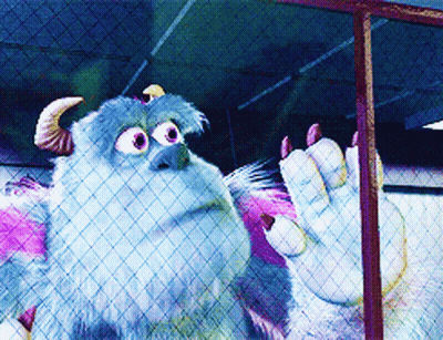 A Monster From The Movie Monsters Inc Is Behind A Fence GIF