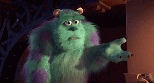 A Monster From The Movie Monsters Inc Is Standing In A Dark Room GIF